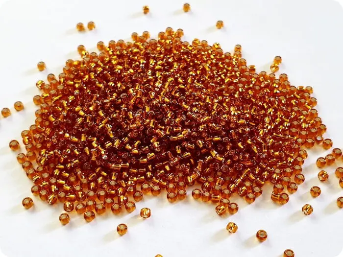 KORALIKI TOHO 11/0 SILVER LINED topaz (22C) 10g