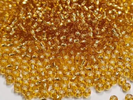 Koraliki TOHO 11/0 SILVER LINED topaz (22B) 10g