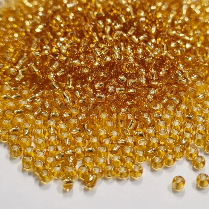 Koraliki TOHO 11/0 SILVER LINED topaz (22B) 10g
